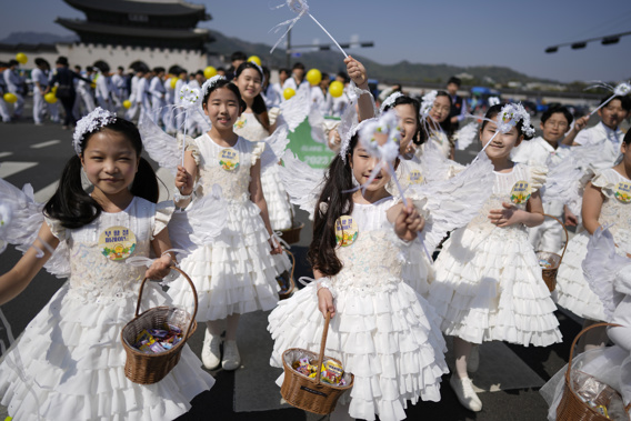Children dressed as angels march during an Easter parade in Seoul, South Korea, on April 9, 2023. Photo / AP