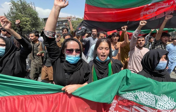 A group of people march with Afghan flags during the Afghanistan's Independence Day rally in Kabul, Afghanistan. (Photo / AP)