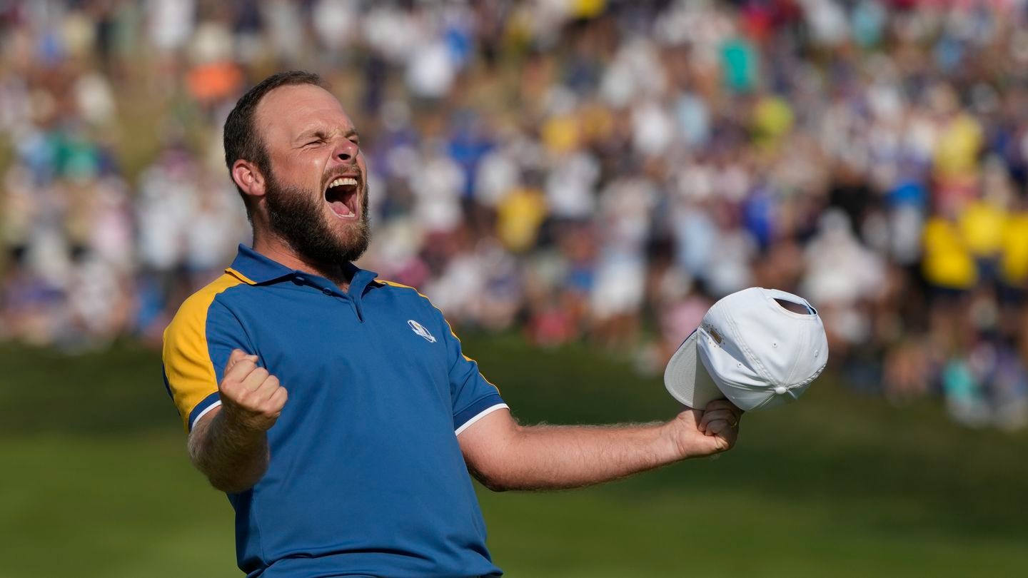 Europe's Tyrrell Hatton celebrates after winning his singles match on the 16th green. Photo / AP
