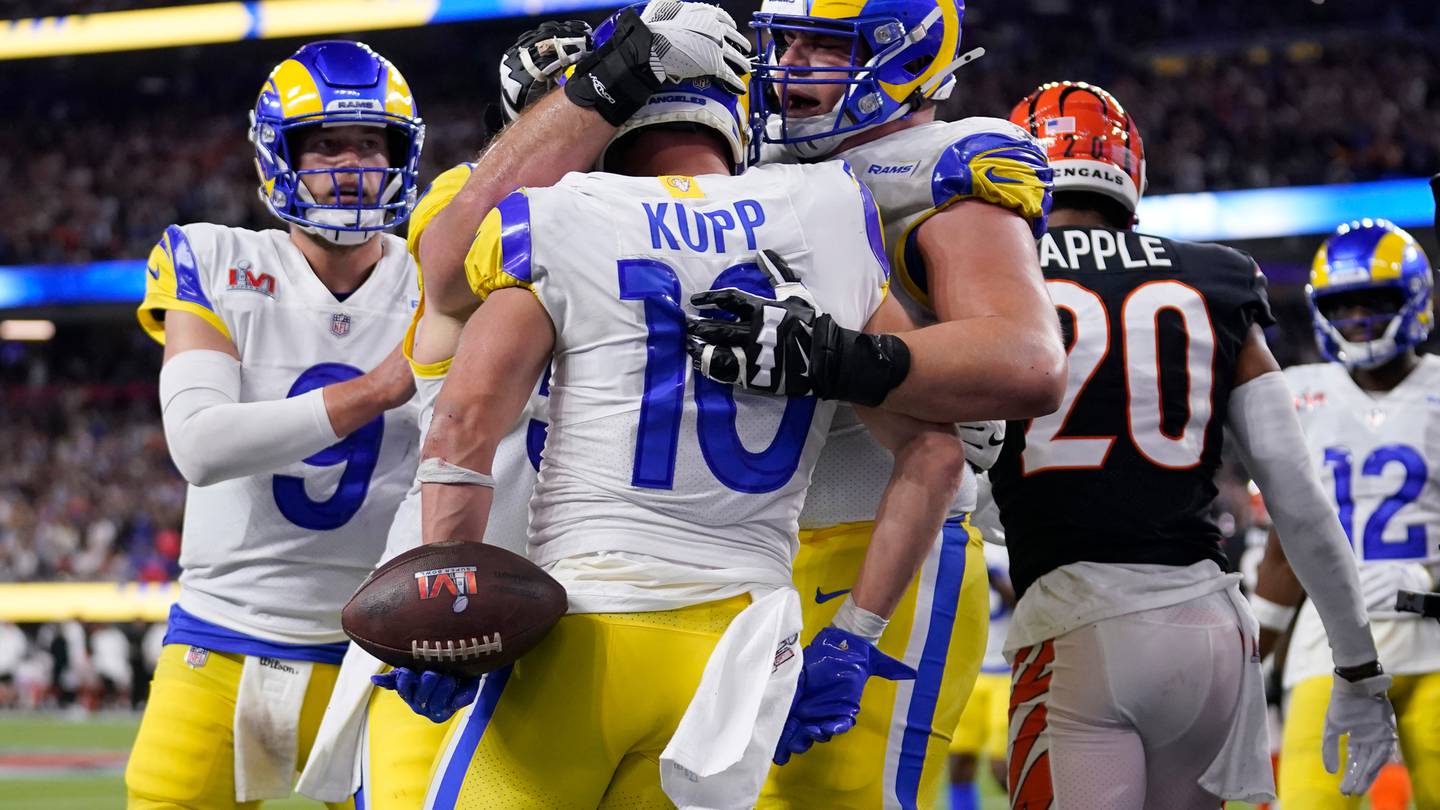 Los Angeles Rams wide receiver Cooper Kupp is congratulated by teammates after scoring a touchdown. Photo / AP