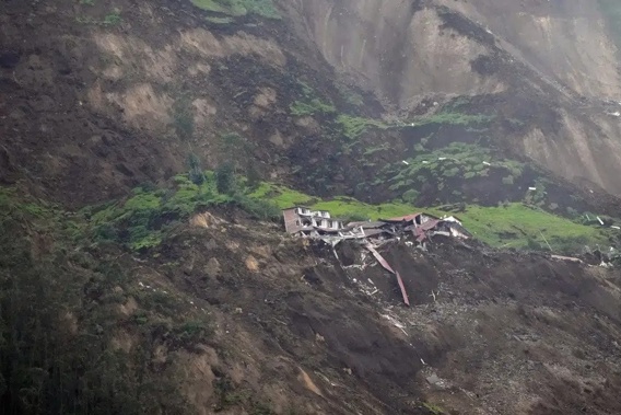 Homes are destroyed after a deadly landslide that buried dozens of homes in Alausi, Ecuador, Monday, March 27, 2023. (AP Photo/Dolores Ochoa)