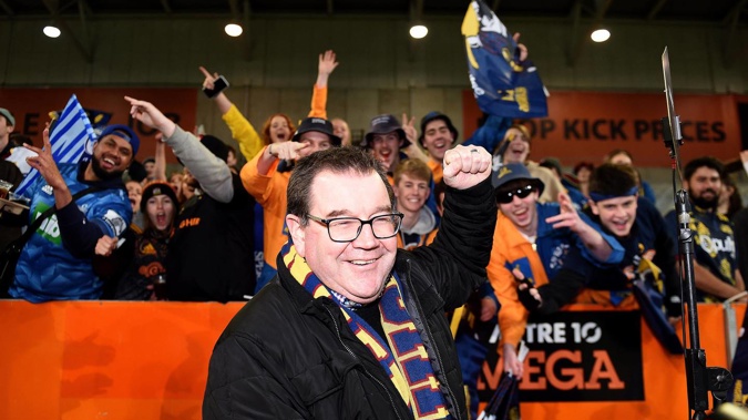 Sports Minister Grant Robertson poses for a photo with crowd members from the zoo during last year's Super Rugby Aotearoa clash between the Highlanders and Chiefs. (Photo / Photosport)