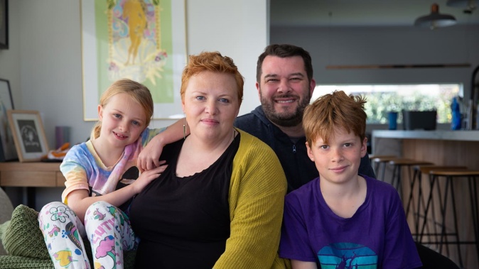 Pippa van Paauwe, 40, has stage 4 cervical cancer. This developed after two of her previous smear tests were misread, due to human error. Photographed at home in September 2023 with her husband JD, and children Jarvis and Bea. Photo / Sylvie Whinray