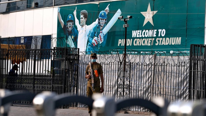 A police officer stands guard outside the Pindi Cricket Stadium following canceling of 1st one day international cricket match between Pakistan and New Zealand, in Rawalpindi. (Photo / AP)