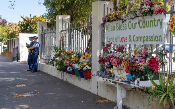 Police officers keep watch outside the Al Noor Mosque in Christchurch. Photo / Mark Mitchell