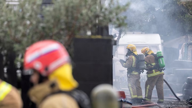 Firefighters on the scene of a residential blaze in Kaiapoi, Christchurch. Photo / George Heard
