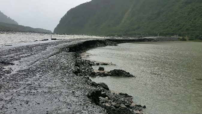 Large parts of highway on both sides of the Haast township was washed away by rains from ex-cyclone Fehi. (Photo: Department of Conservation)