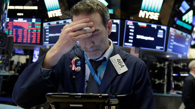 The Dow Jones industrial average plunged nearly 1,600 points Monday as two days of steep losses for U.S. stocks brought an end to a period of record setting calm in the market.(Photo \ AP)