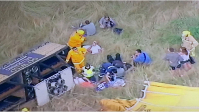 Paramedics assess the injured after balloon plummets a reported 500m.