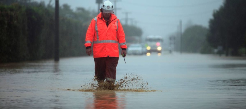 Rural fire chief Colin Eggers makes his way through floodwater in Riwaka after Cyclone Gita hit the town near Nelson hard. (Photo / Tim Cuff)