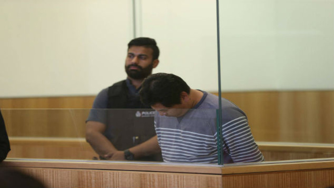 Adam Gan Bin Abdullah in the dock at the Manakau District Court after pleading guilty to immigration fraud. (Photo/Doug Sherring).