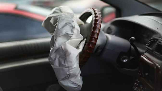 A deployed airbag is seen in a Chrysler vehicle (Photo \ Getty Images) 