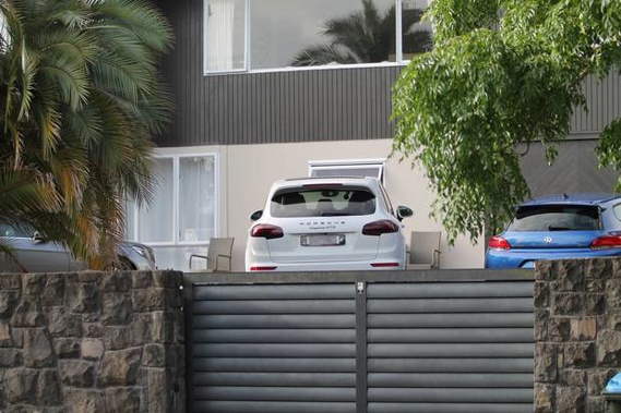 Cars parked in the driveway of a house belonging to Hooi Keat Chai. (Photo / Sam Hurley)