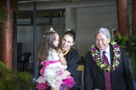 Jacinda Ardern with Deputy PM Winston Peters are greeted in Niue by Ardern's niece. (Photo / Michael Craig)