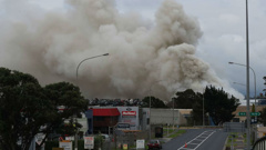 Firefighters are still battling to extinguish a huge fire at an Auckland scrap metal plant. (Photo \ NZ Herald)