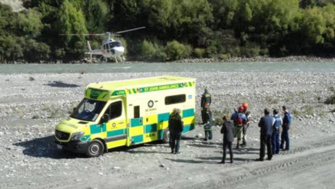 A rescue helicopter lands on the beach by Edith Cavell Bridge, Arthurs Point. Photo / Guy Williams 