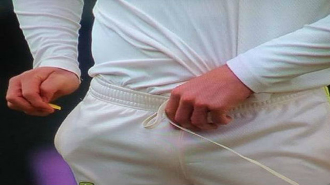 Cameron Bancroft was caught fiddling with a small yellow object in his hand. (Photo / AP)