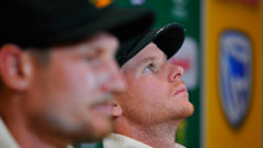 Cameron Bancroft (foreground) and Steve Smith (in focus) have admitted to ball tampering in their 322-run loss to South Africa. (Photo \ Getty Images)