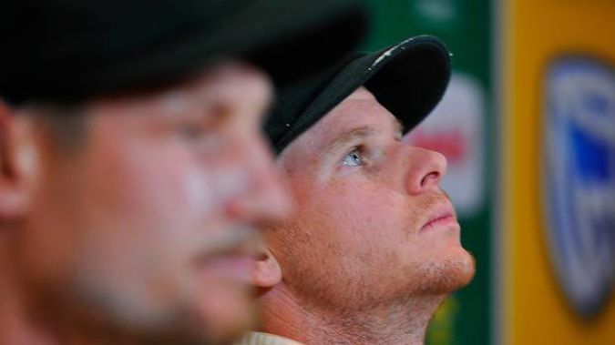Smith Smith looks up in a press conference after admitting to cheating. (Photo / Getty)