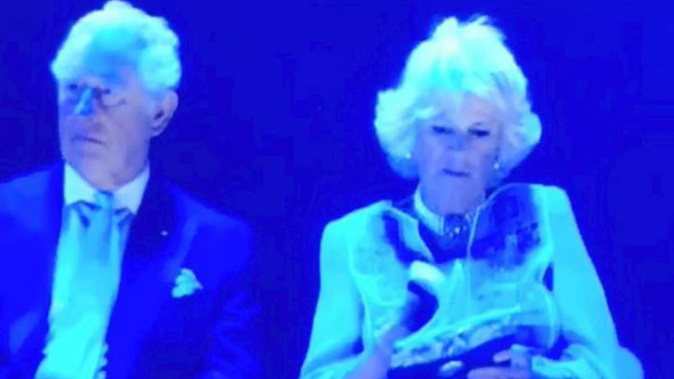 Camilla, Duchess of Cornwall, was seen flicking through a magazine during the Commonwealth Games opening ceremony on the Gold Coast last night.