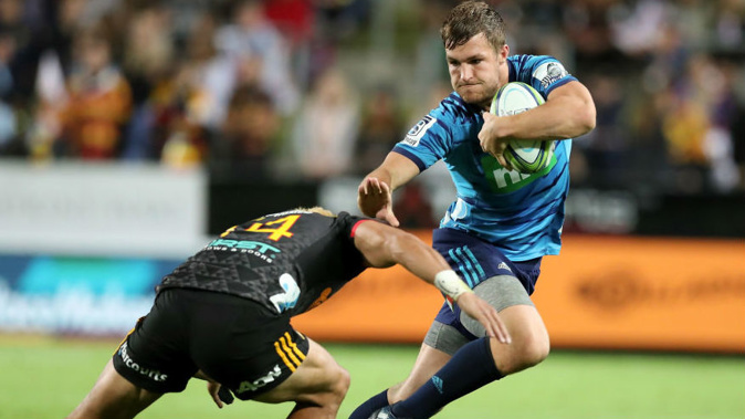 The Blues' Michael Collins attempts to break a tackle in Hamilton. (Photo \ Getty Images)