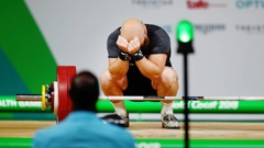 Richie Patterson rejects after crashing out of contention in the men's 85kg weightlifting. (Photo \ Photosport)