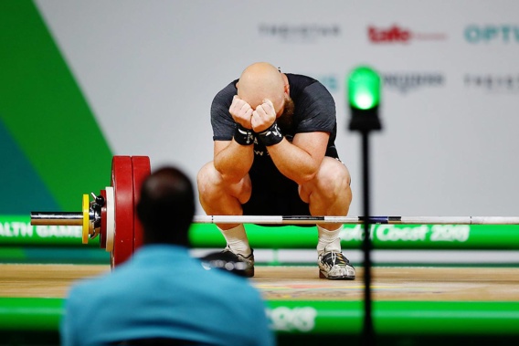Richie Patterson rejects after crashing out of contention in the men's 85kg weightlifting. (Photo \ Photosport)
