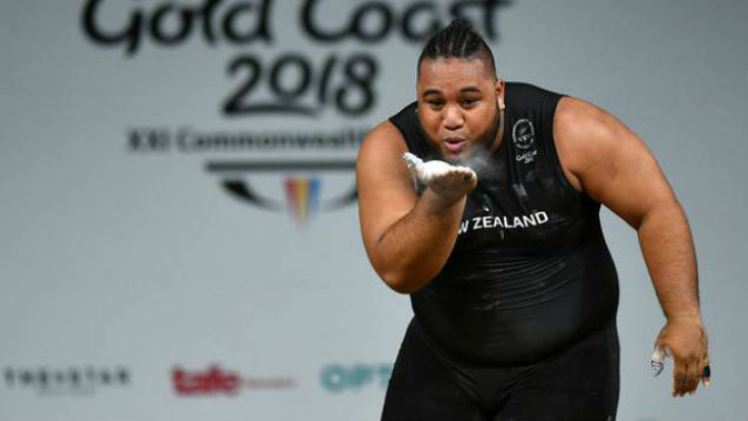 David Liti of New Zealand blows the judges a kiss after completing a lift in the Men's +105kg Final. (Photo / Getty)