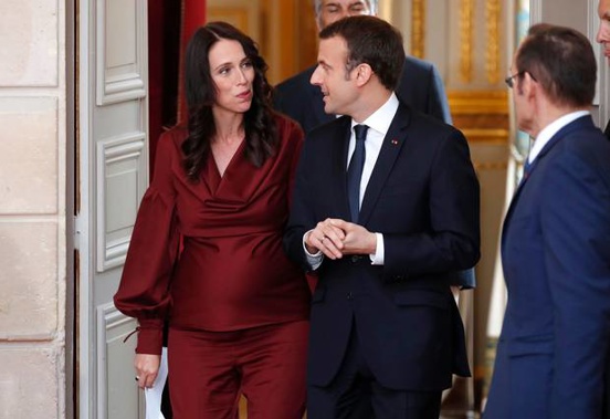 Jacinda Ardern went from a meeting with French President Macron to doing a lecture on climate change. (Photo / AP)