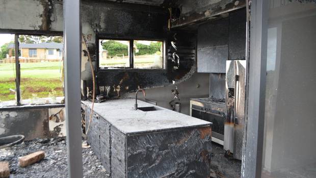 Damage to the kitchen of a Pukekohe show home left by a "suspicious" fire. Photo / Supplied