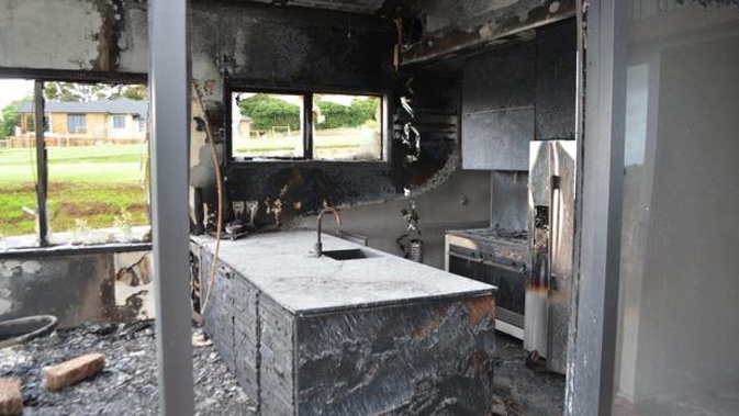 Damage to the kitchen of a Pukekohe show home left by a "suspicious" fire. Photo / Supplied