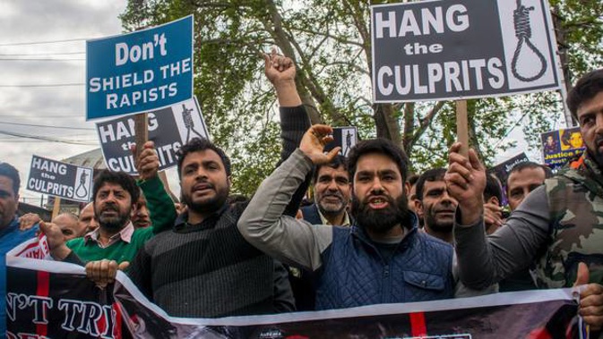 Kashmir Muslims hold placards and chant slogans during a protest in Srinagar yesterday demanding justice for the 8yo girl raped and murdered recently. (Photo / Getty)
