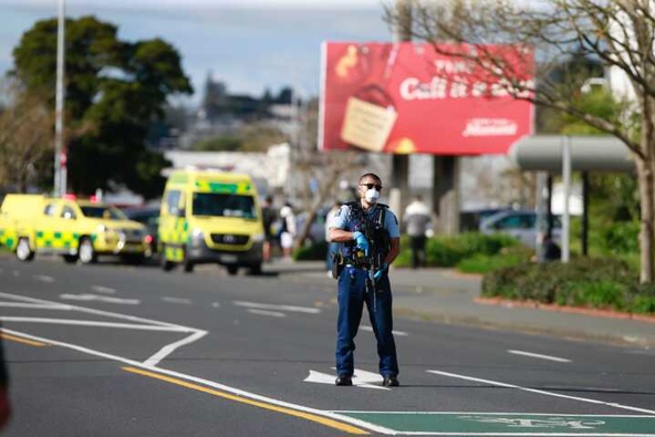 A police officer outside LynnMall in west Auckland after an incident at Countdown. (Photo / Alex Burton)