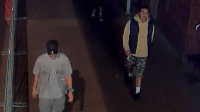 The two victims had been walking along Queen St around 2.30am on Sunday when the group of around eight men, pictured, approached them. (Photo / via Police)