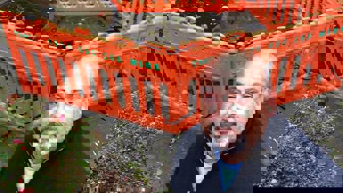 Andrew Thomson stand above the sinkhole that swallowed him up as he fed his fish. (Photo / Supplied)