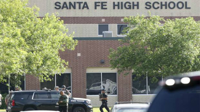 Law enforcement officers respond to Santa Fe High School after an active shooter was reported on campus. (Photo / AP)