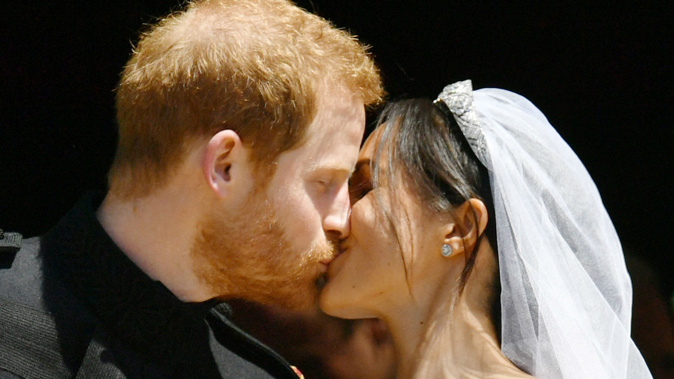 Prince Harry and Meghan Markle kiss after their wedding. (Photo / Getty Images)