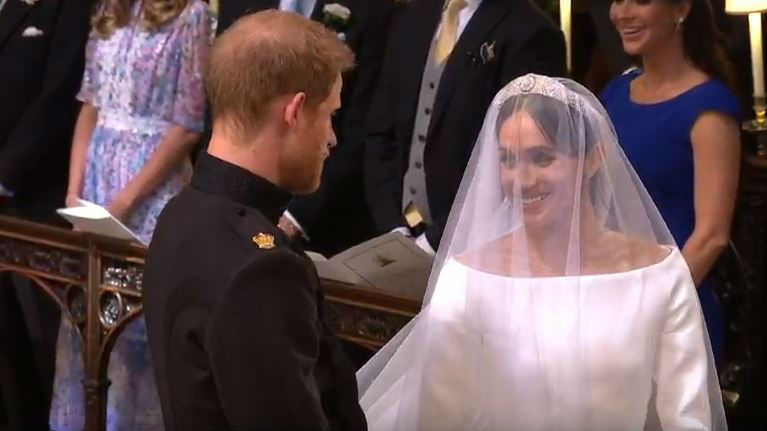The first full sight of the dress as Meghan arrives at Windsor Chapel. (Video / AP)