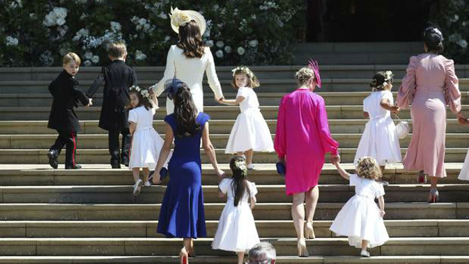Britain's Prince George, left, Princess Charlotte, third left, Kate, the Duchess of Cambridge, background fourth left and Jessica Mulroney foreground arrive with the bridesmaids, page boys. (Photo / AP)