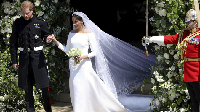 Prince Harry and Meghan Markle after their wedding ceremony. (Photo \ AP)
