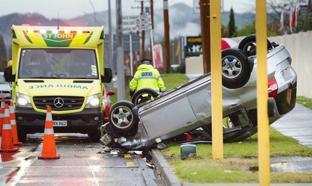 The car came to a rest upside down at the intersection of Te Ngae Rd and Brent Rd.(Photo/Ben Fraser)