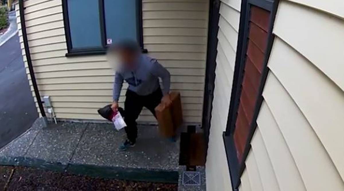Thief steals parcel left by couriers outside house in Albany Village. (Video: Supplied by Emma Roberts)