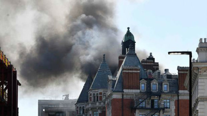 Smoke rises from the Mandarin Oriental Hotel London (Photo: AP)