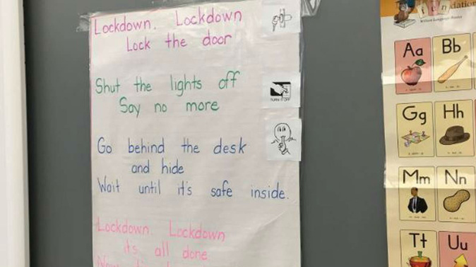 "Lockdown, lockdown, lock the door, shut the lights off say no more," read the lyrics on the classroom wall, which are reportedly sung to the tune of Twinkle Twinkle Little Star. (Photo \ Twitter)