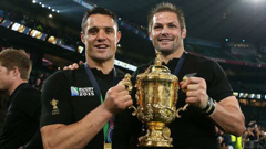 Dan Carter and Richie McCaw pose with the Webb Ellis Cup after the 2015 Rugby World Cup. (Photo \ Getty Images)