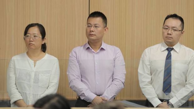 Kang Xu, lawyer Gang Chen and former banker Zongliang Jiang pictured during the start of their trial. (Photo / Michael Craig)