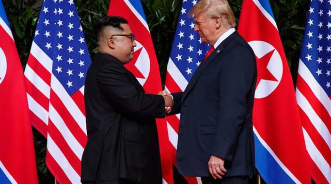After arriving in Singapore, an antsy and bored President Trump urged aides to demand that the meeting with Kim Jong Un be pushed up a day earlier. Photo / AP