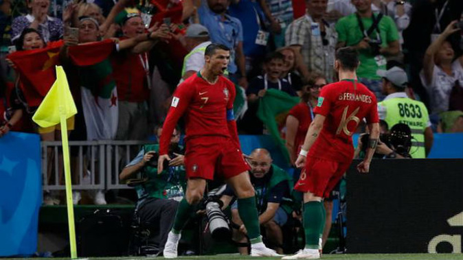Portugal's Cristiano Ronaldo, celebrates during the group B match between Portugal and Spain. (Photo / AP)