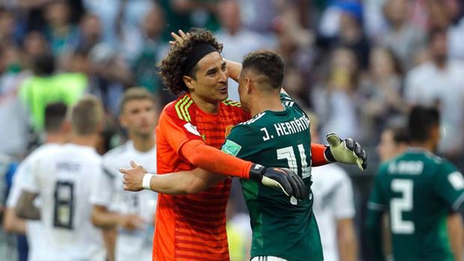 Mexico's Javier Hernandez and goalkeeper Guillermo Ochoa, left, celebrate their win over Germany. Photo / AP