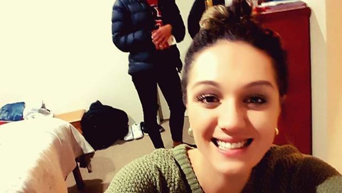 A police officer stands guard at the entrance of a right of way on Aurora Tce, Hamilton, after a woman appeared to have died in suspicious circumstances at the weekend. Photo/Belinda Feek